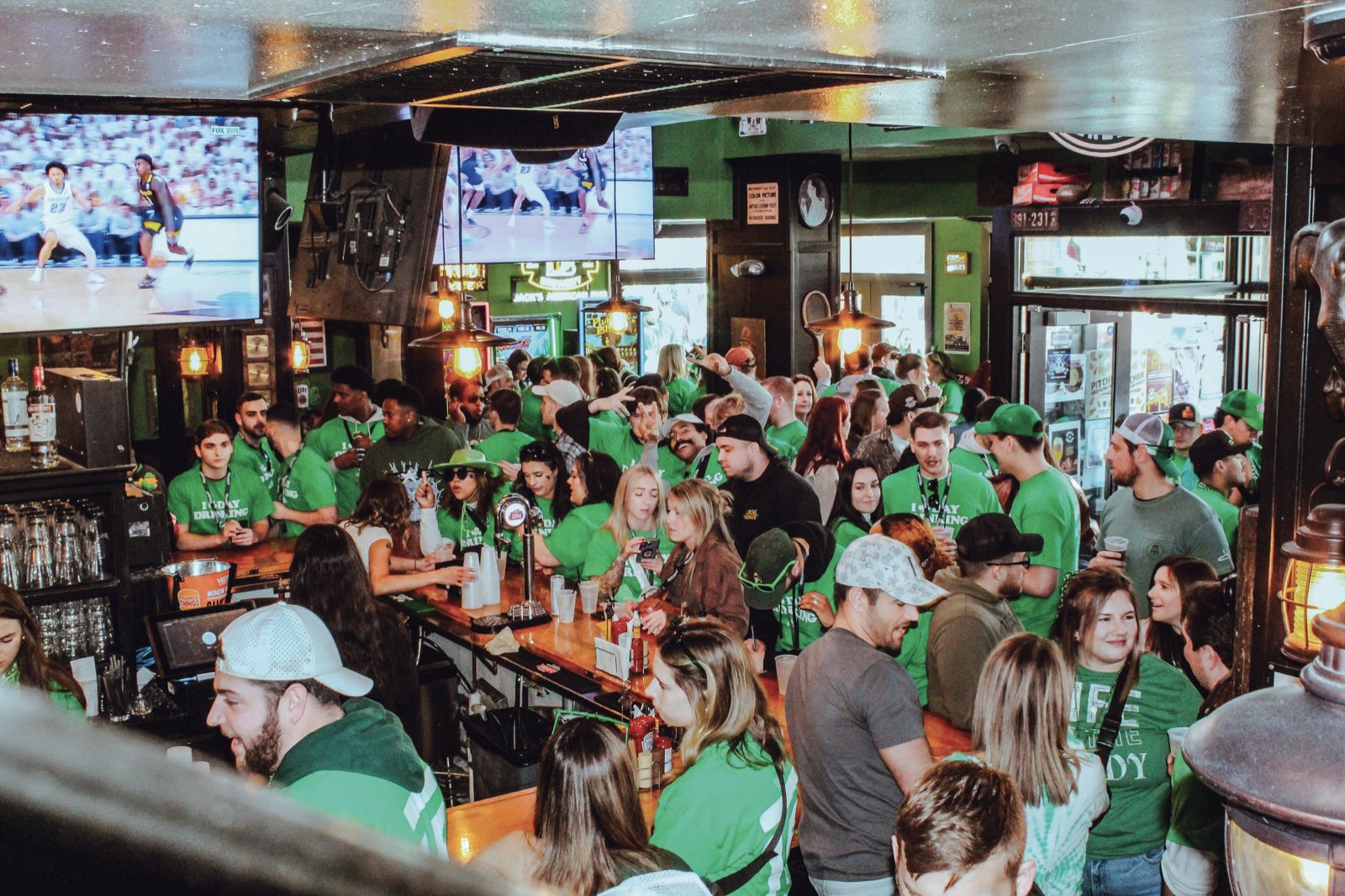 A packed Milwaukee bar on St Patrick’s Day, the whole room in green shirts